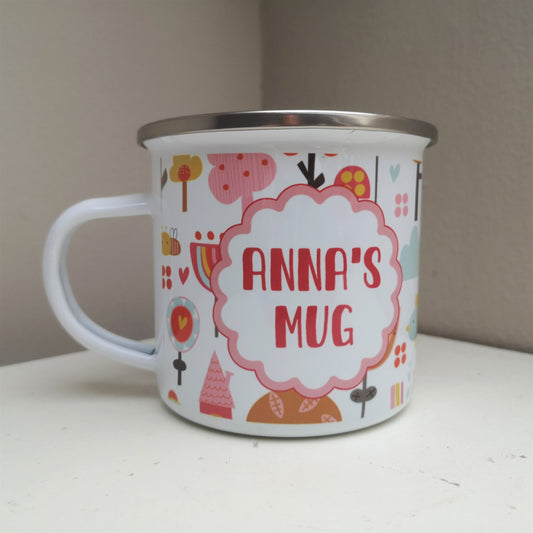 A White enamel mug with a stainless steel rim with a wraparound pink garden design and on the front a scalloped pink circle framing the owners name