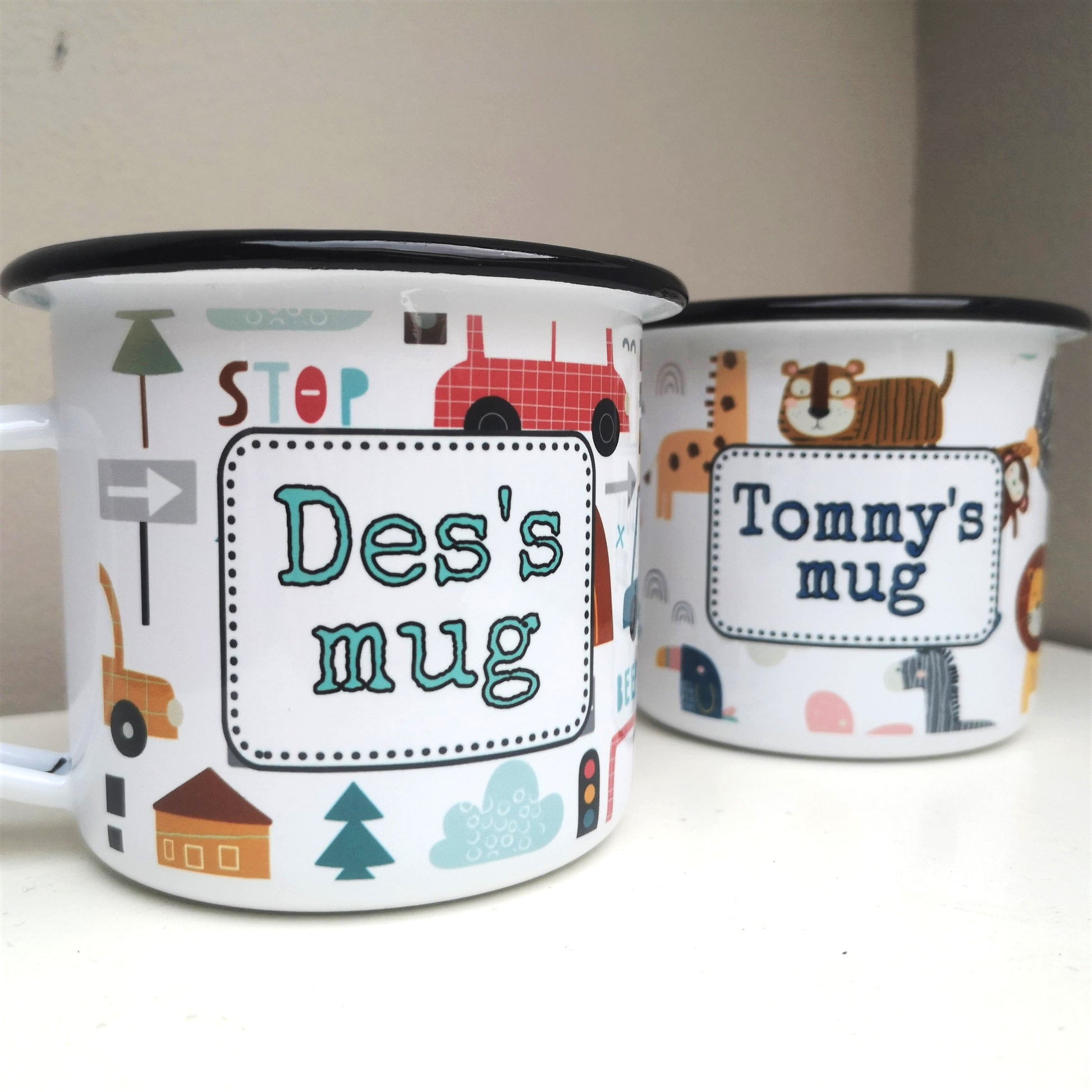 Another view of two Personalised Boys Enamel Mug Traffic and Safari Themes